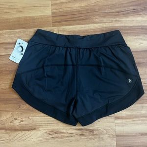All black Tonic Active running shorts.